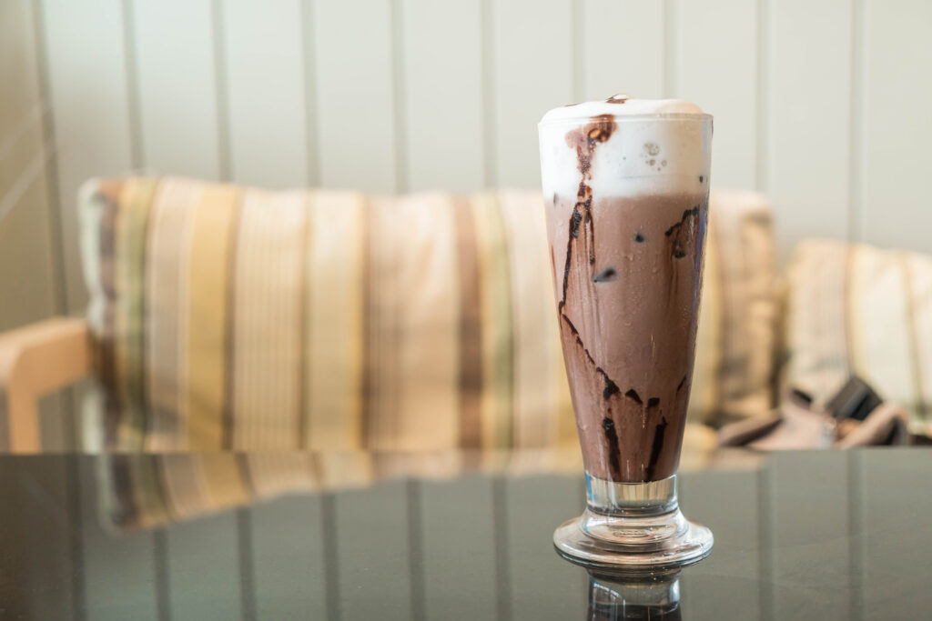 chocolate shake in a long glass in a table