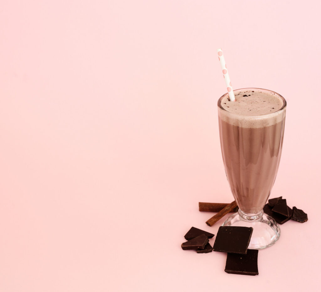 chocolate shake in a glass with straw